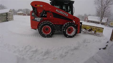 Snow plowing with Kubota skid steer 